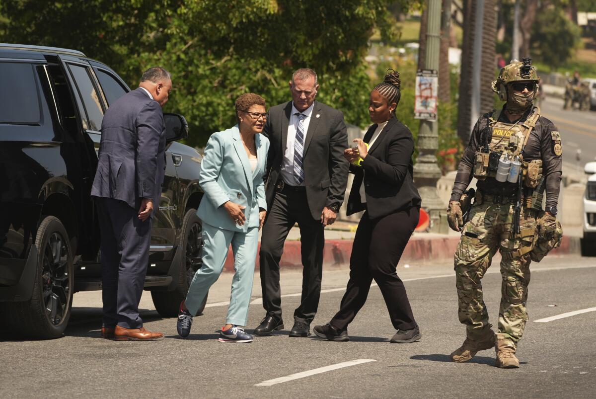 L.A. Mayor Karen Bass arrives at MacArthur Park on July 7 as federal agents staged there.