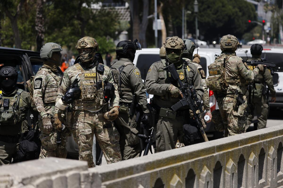 Heavily armed federal immigration agents near MacArthur Park in the Westlake area on July 7.
