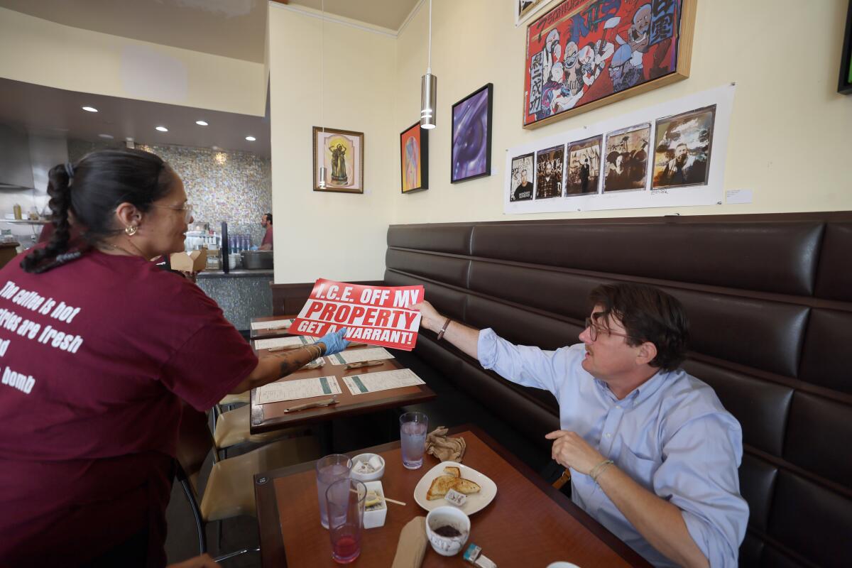 Chris Newman, right, legal council for the National Day Laborer Organizing Network