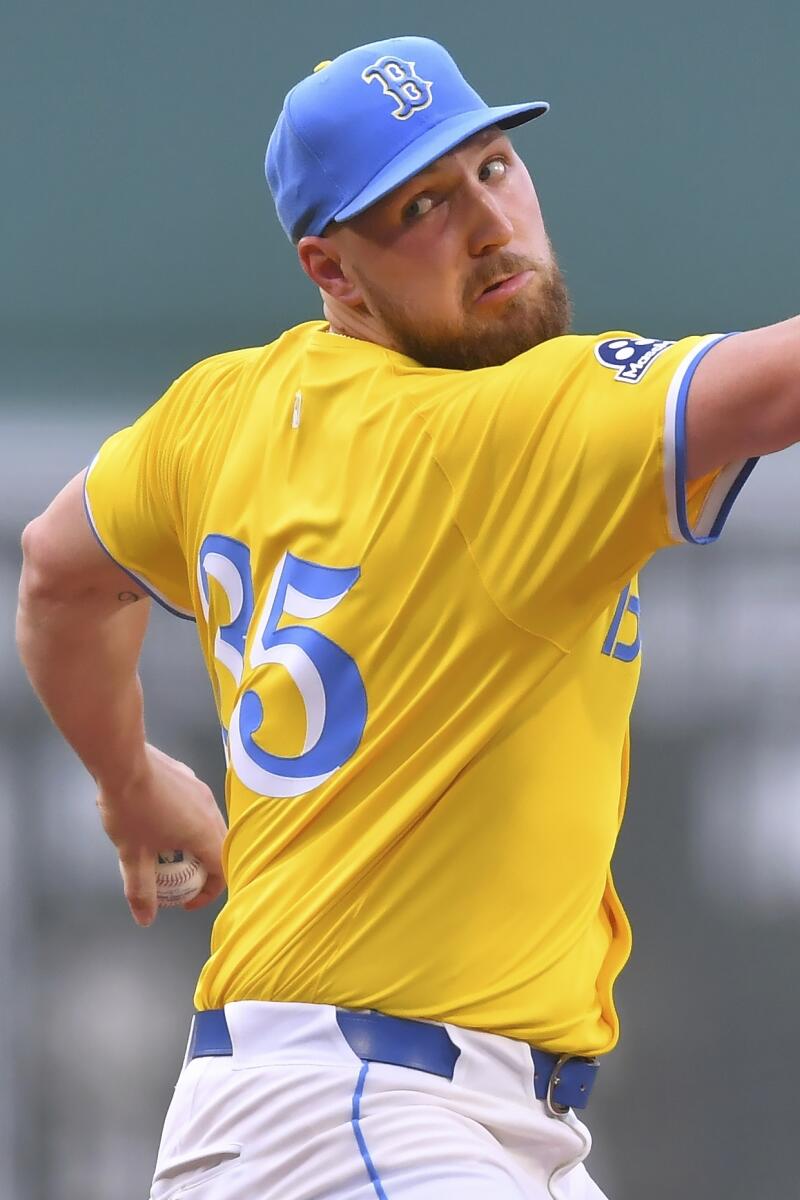 Boston Red Sox's Garrett Crochet winds up to pitch to a Los Angeles Dodgers batter.