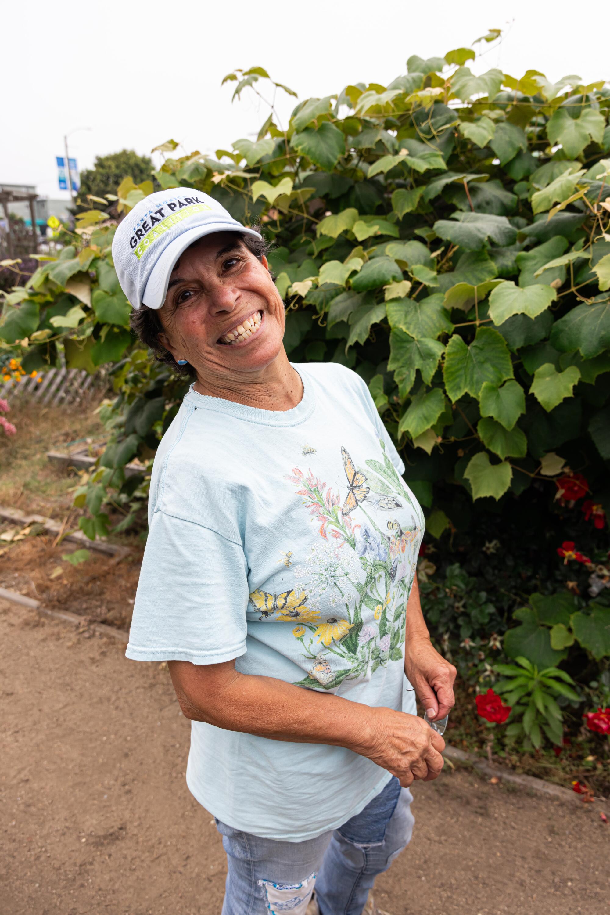 Cris Gutierrez, chair of the Santa Monica Community Gardens Advisory, smiles for a portrait