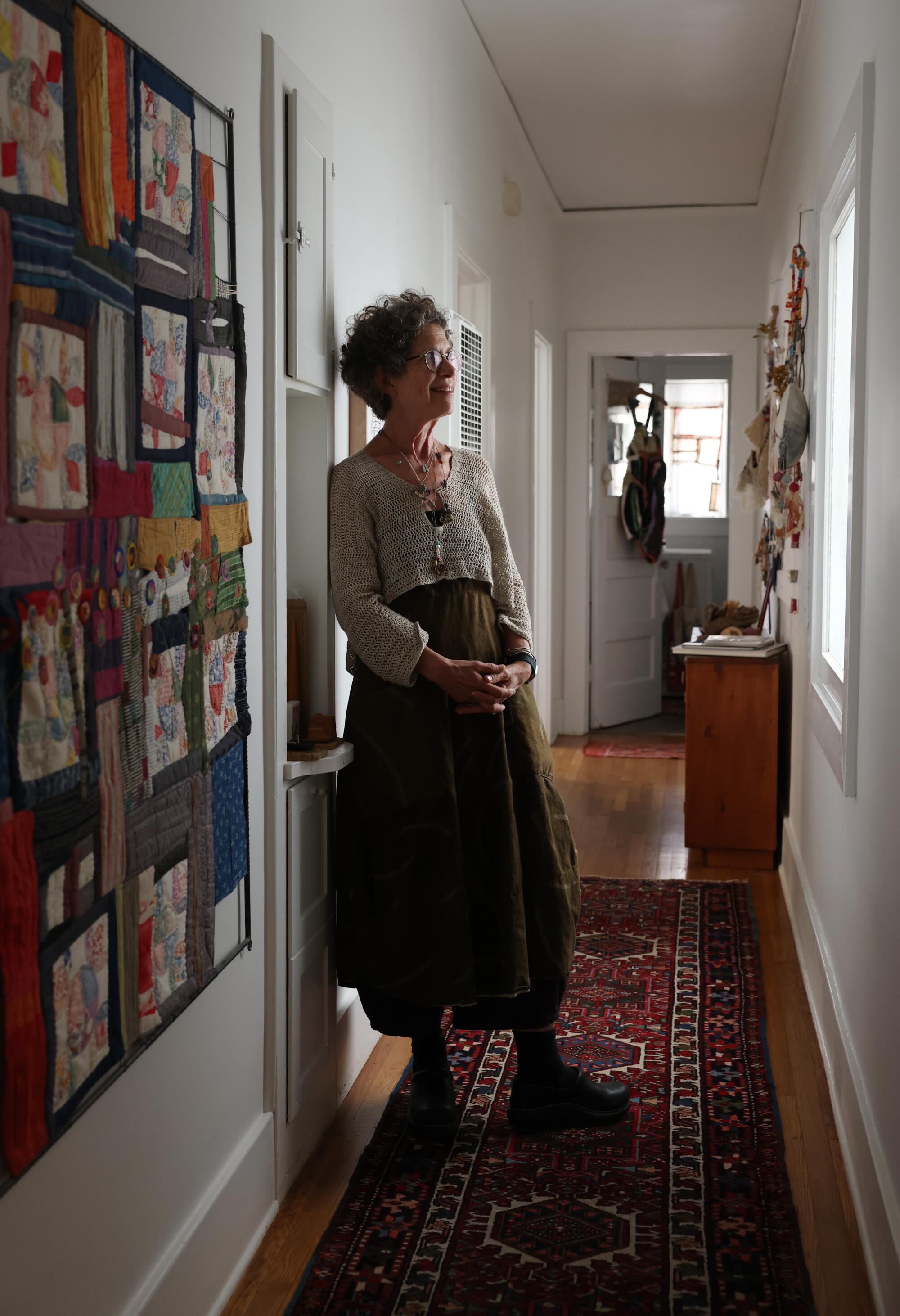 A hallway lined with fiber art 