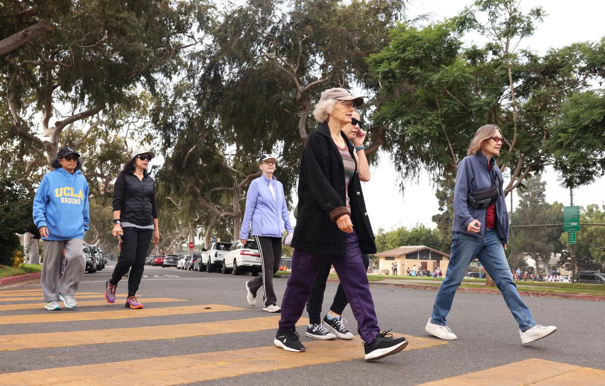 A group of people walking.