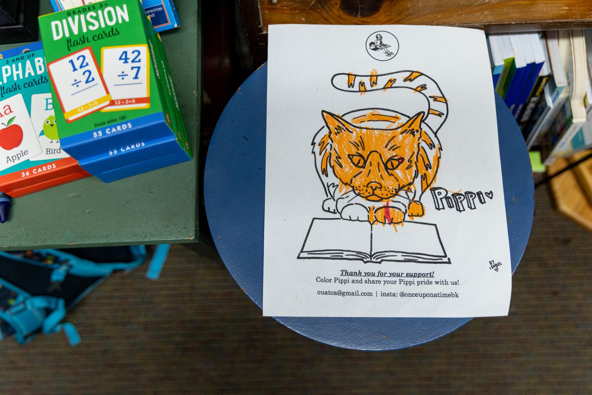 A coloring book page featuring Pippi the cat.