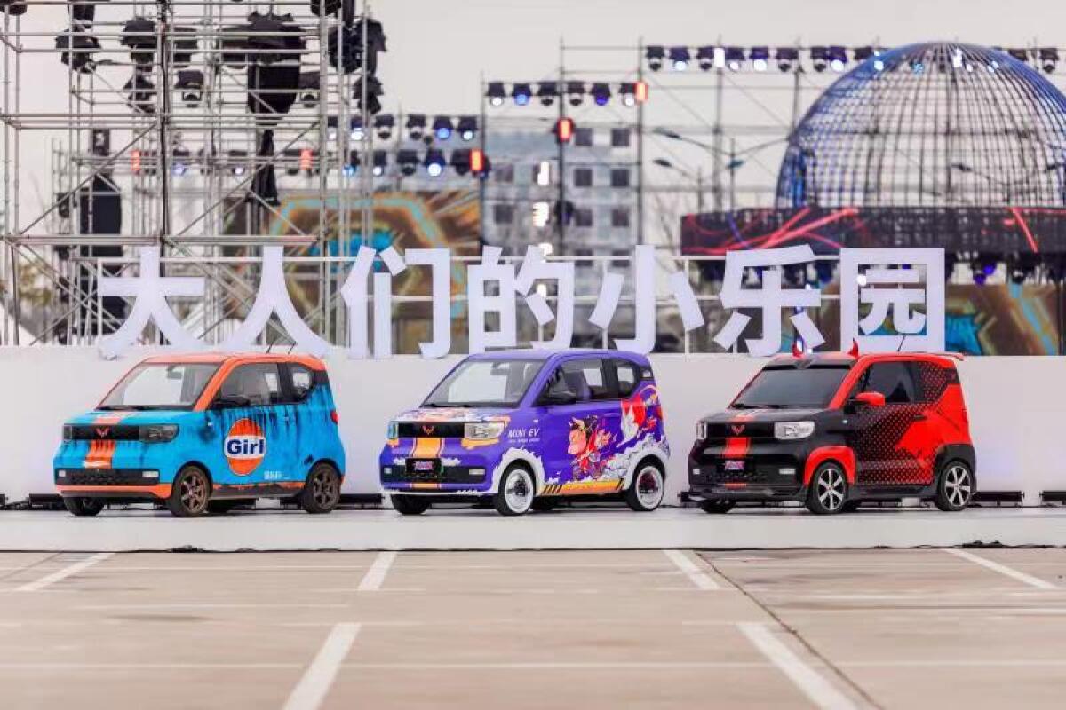 Three Hongguang Mini EVs, the top-selling electric car in China.