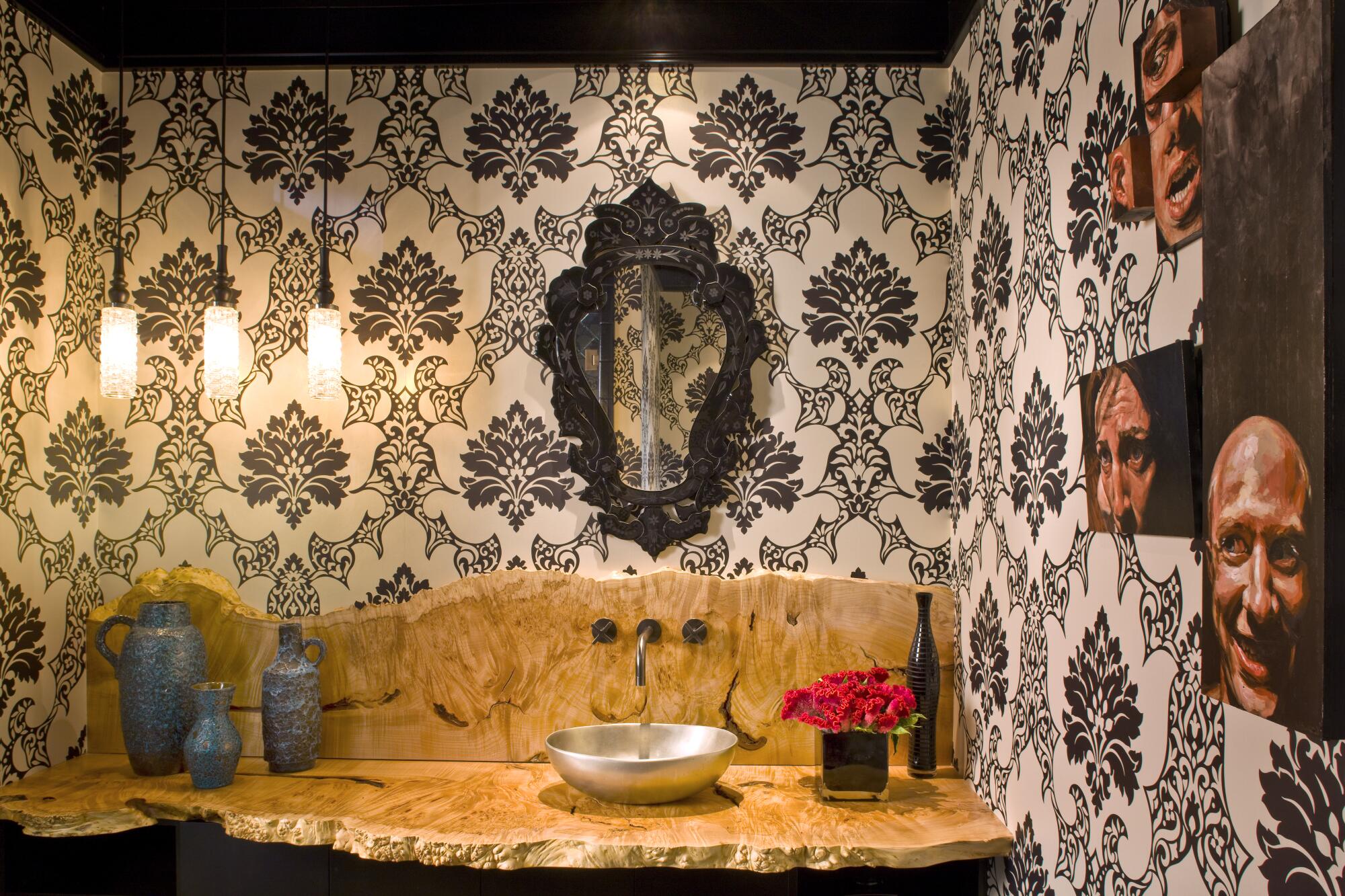 Designer Jeff Andrews added oil paintings for a client seeking a “cool, edgy, funky” feel in the bathroom.