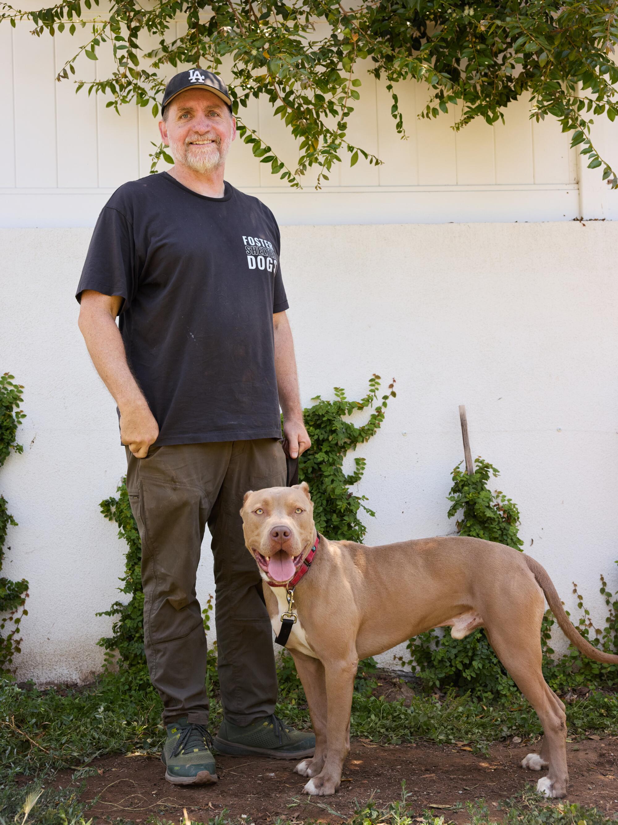 A dog with their foster.