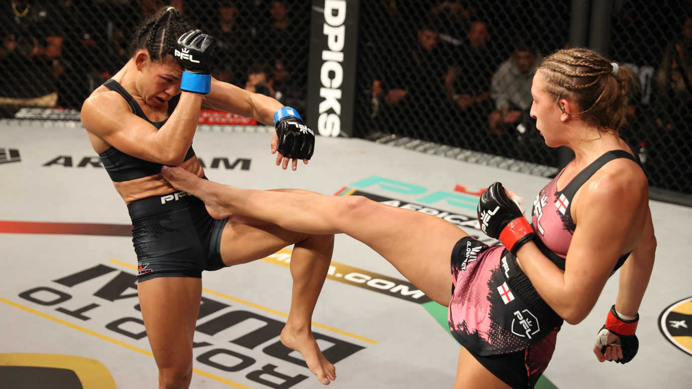 Dakota Ditcheva sinks a leg kick into the body of Sumiko Inaba
