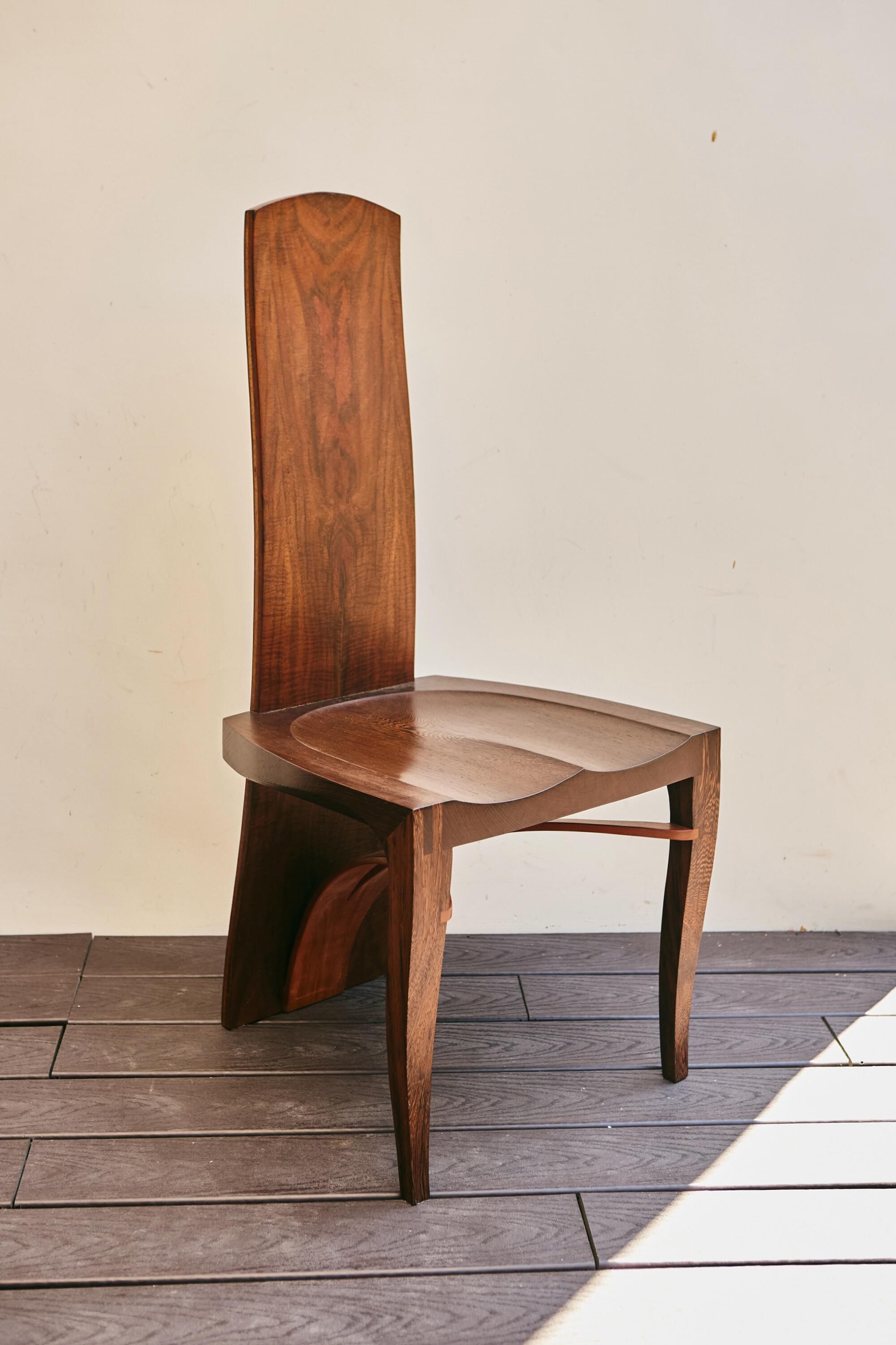 A chair on a wooden deck.