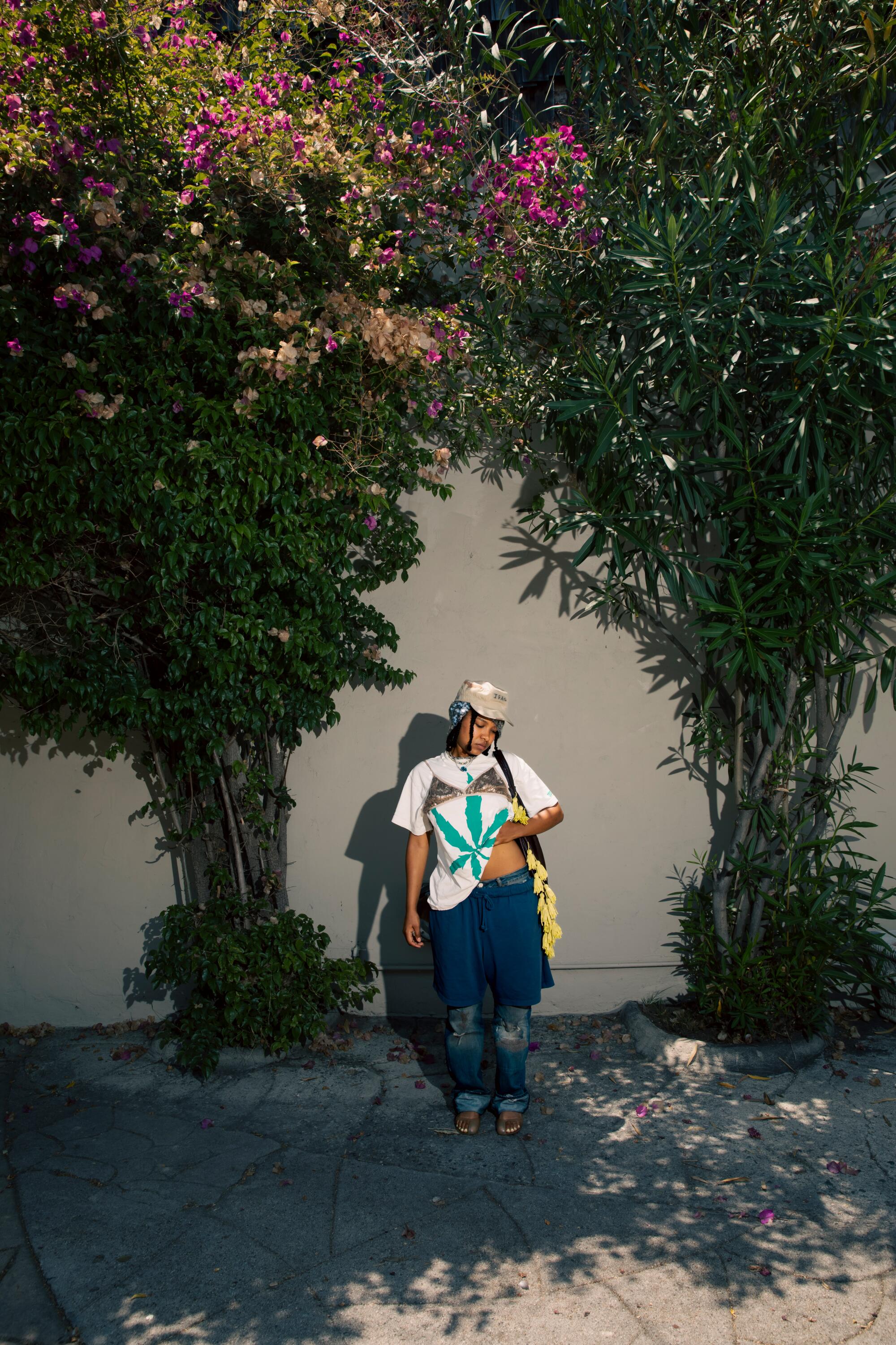 Kaamilah Thomas wears Anna Sui beanie with Dad’s army hat, and Mango shoes.