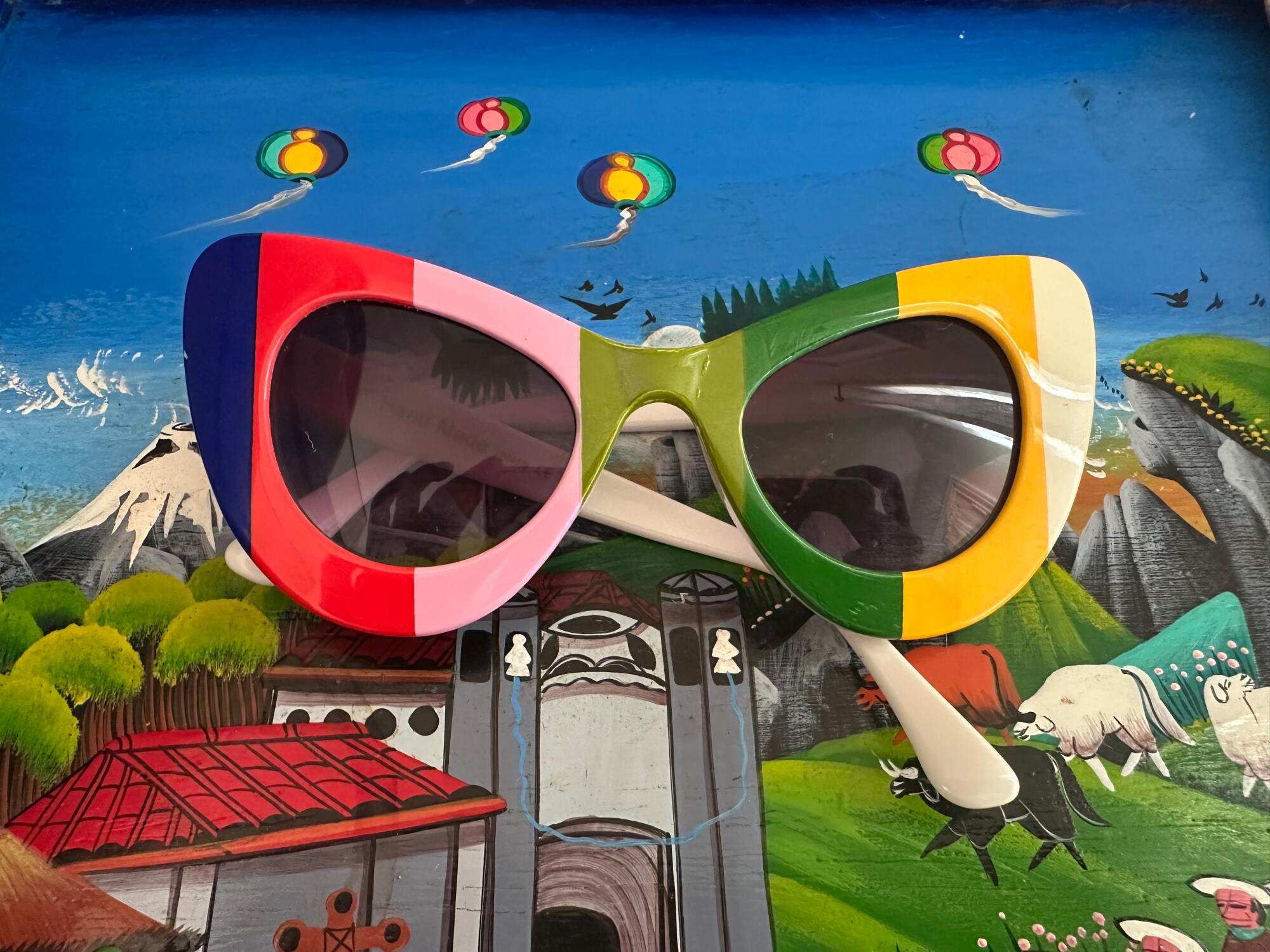 Colorful sunglasses on a colorful tabletop