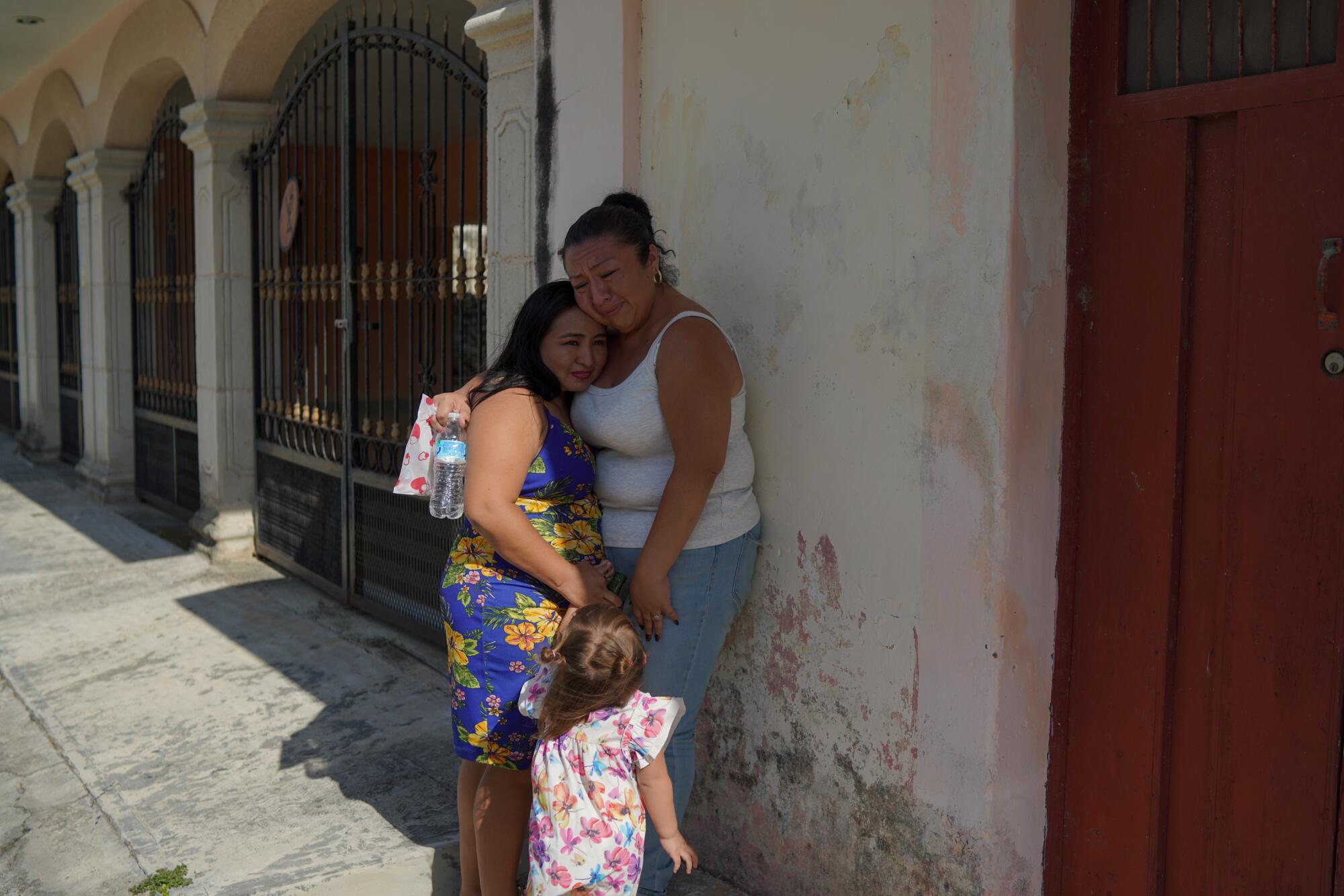 Noemi Ciau is comforted by her cousin Rocio after becoming emotional.
