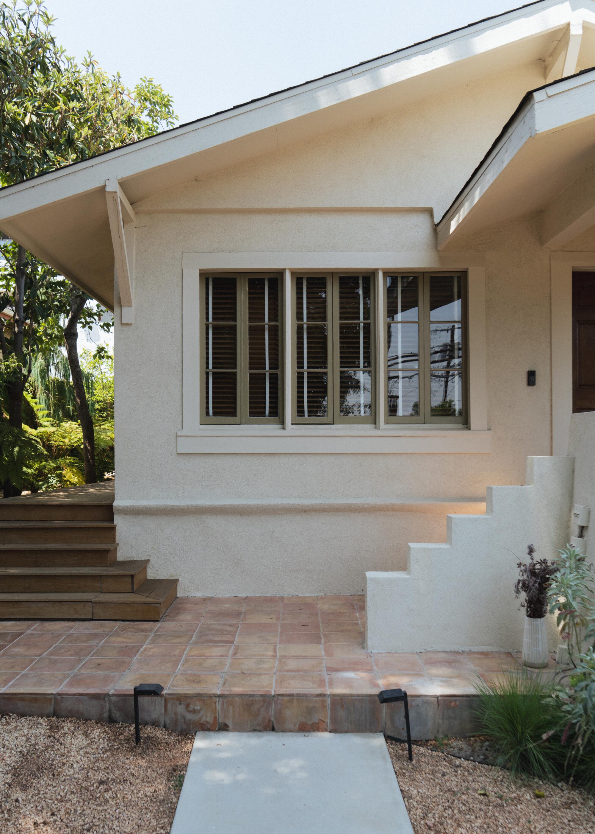 Exterior of a white Craftsman home.