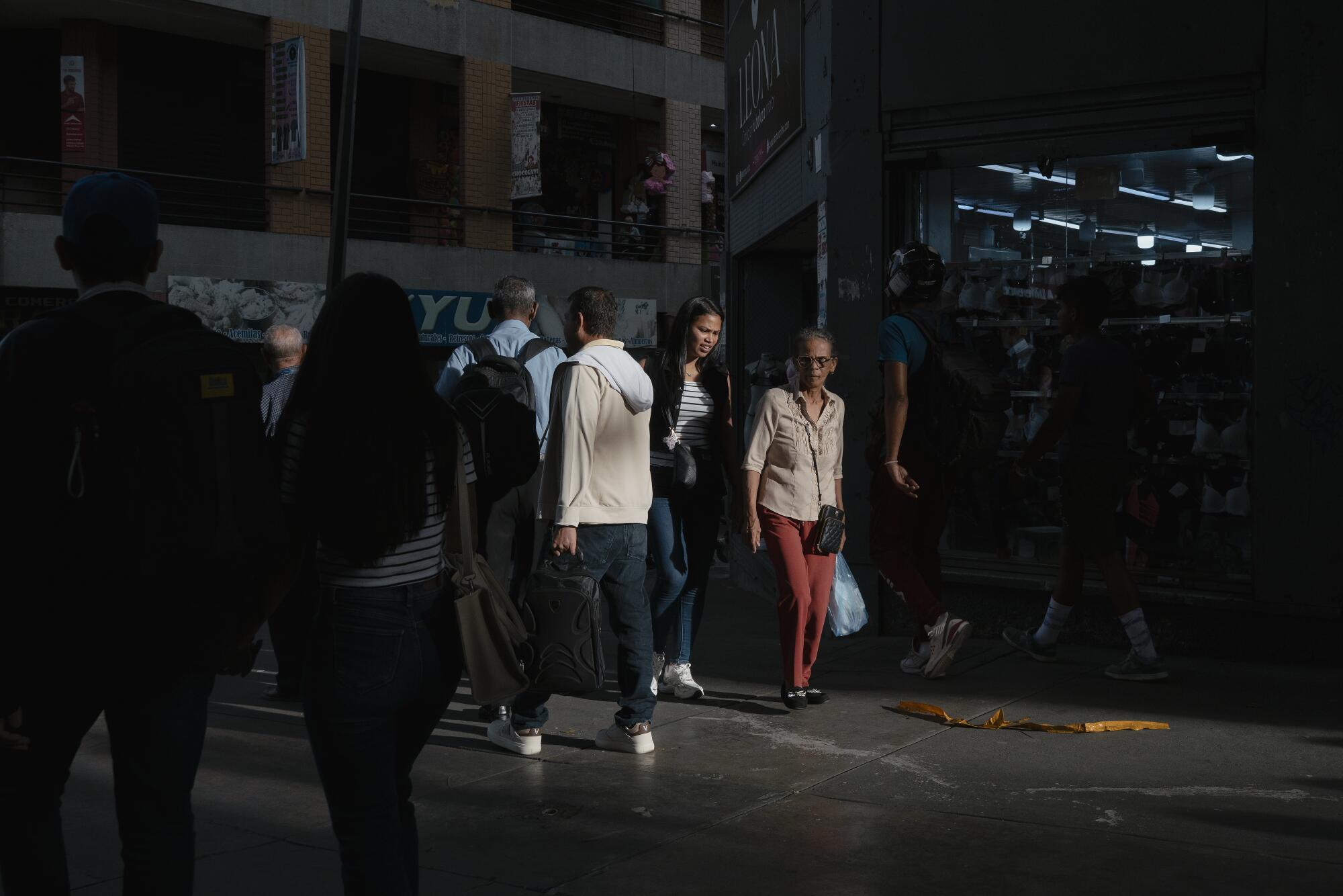 People shop in the central business district downtown.