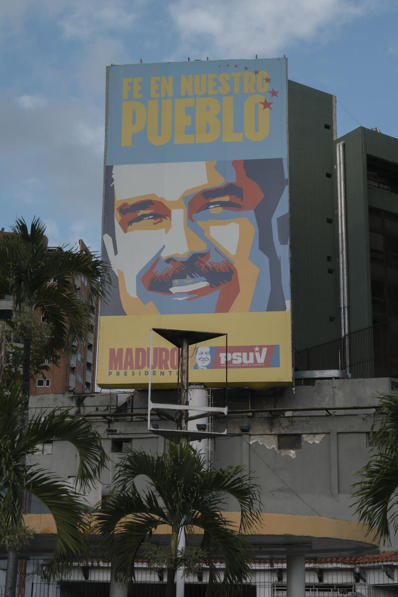 "Faith in our people" says a billboard with President Nicolás Maduro's face in Caracas.