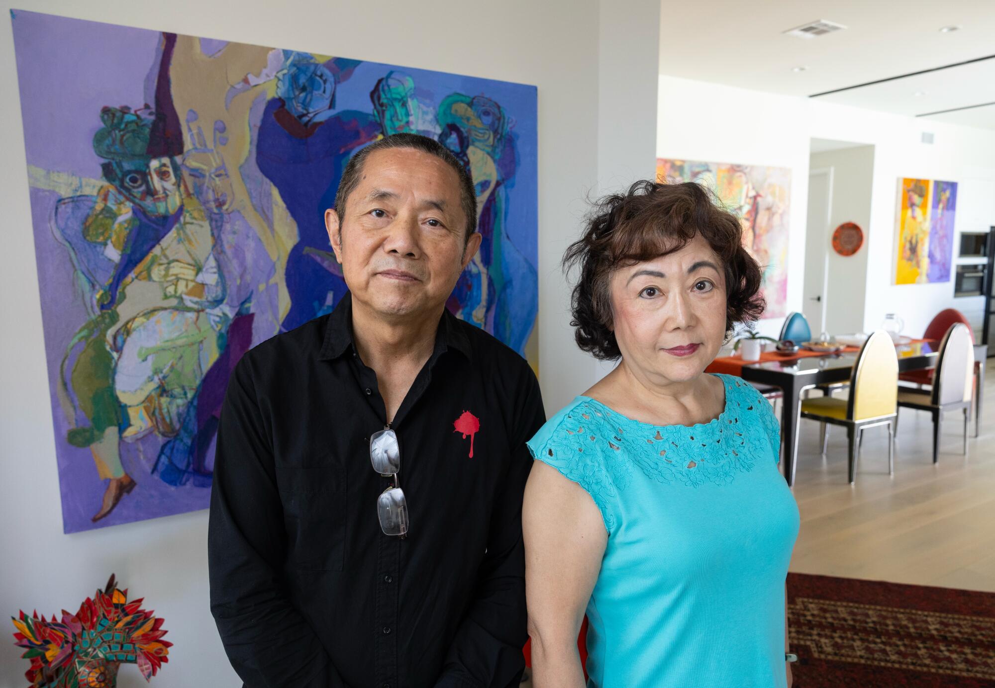 Los Angeles artist Yi Kai and his wife Zheng Jian at their home.