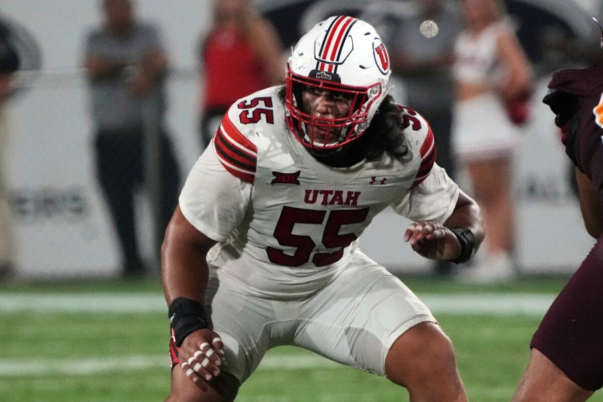 Utah offensive lineman Spencer Fano (55) blocks during a game against Arizona State.