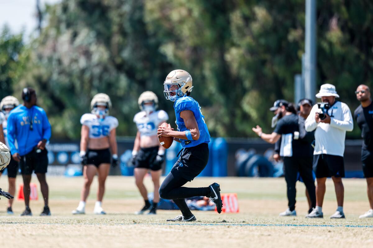 UCLA quarterback Nico Iamaleava looks to pass during UCLA practice on August 4.