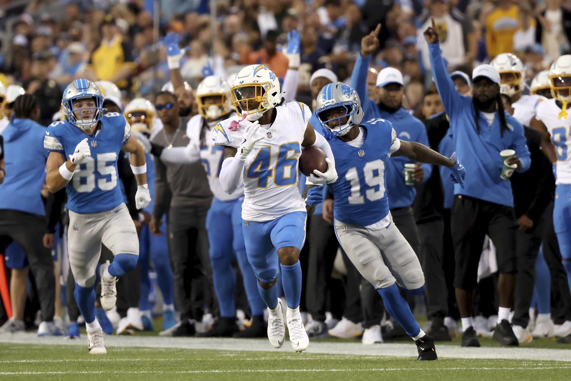 Chargers cornerback Nikko Reed returns an interception during a preseason game against the Detroit Lions.