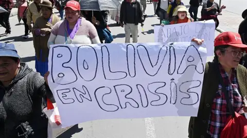 Getty Images People protesting in Bolivia about high food prices