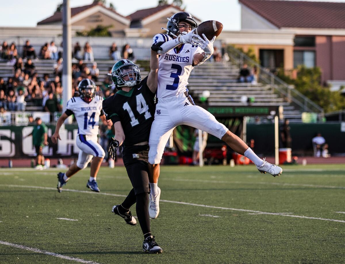 Grayson Ramos of North Hollywood makes a catch on the first play of the game vs. Granada Hills.
