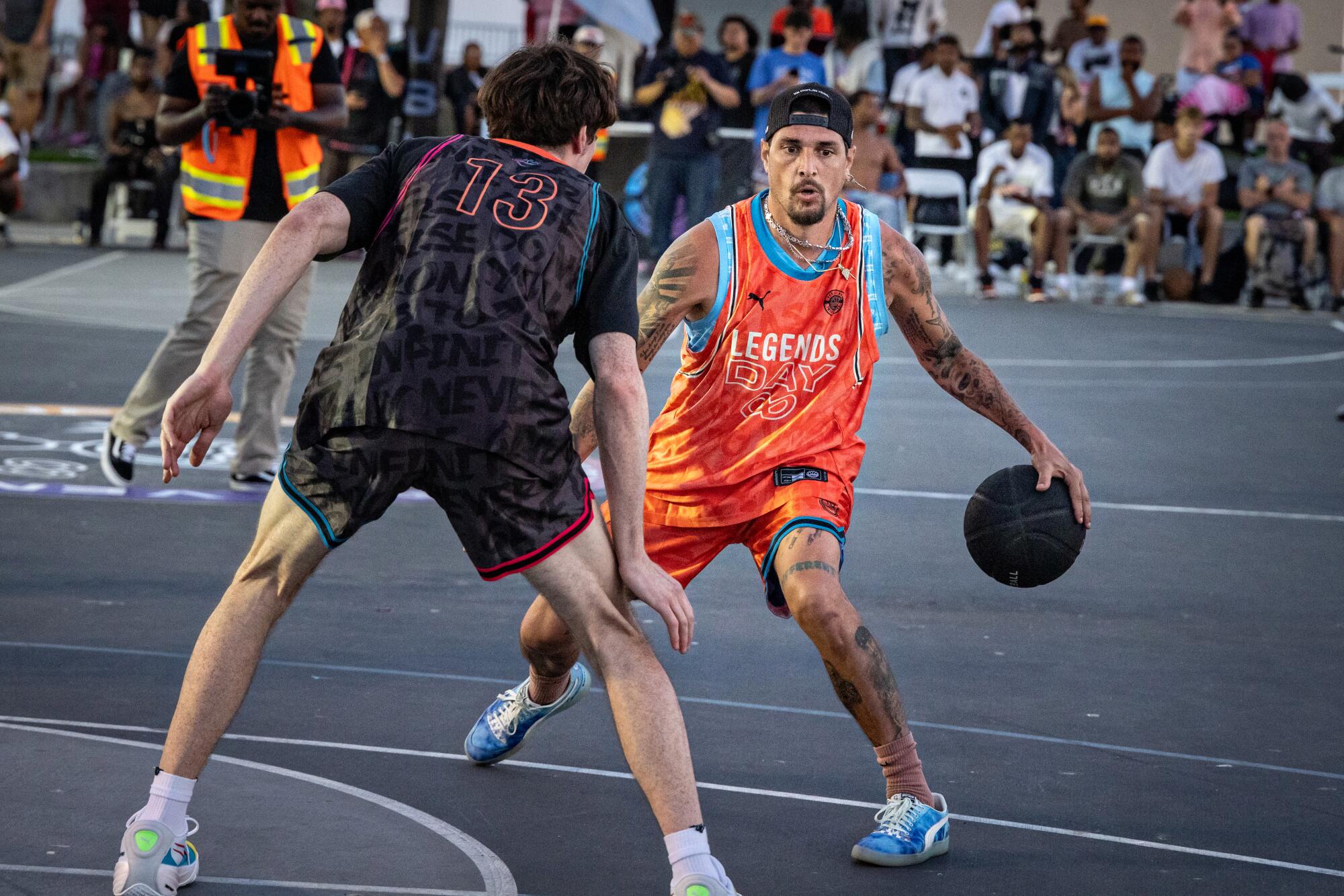 Players compete during Veniceball's "Legends Weekend" competition at Venice Beach on Sunday.