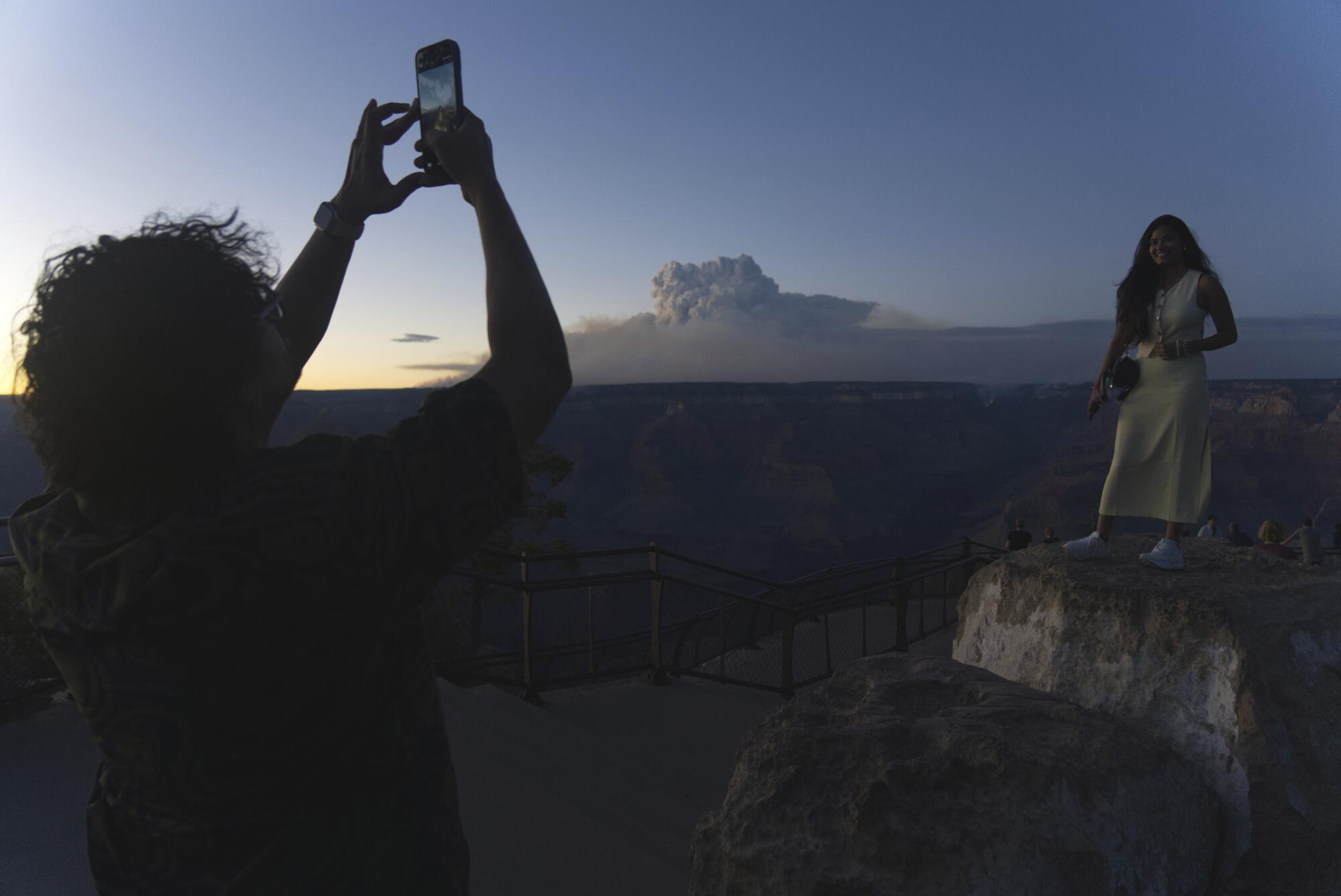 Smoke and a pyrocumulus cloud rise at sunset from the Dragon Bravo fire at the Grand Canyon