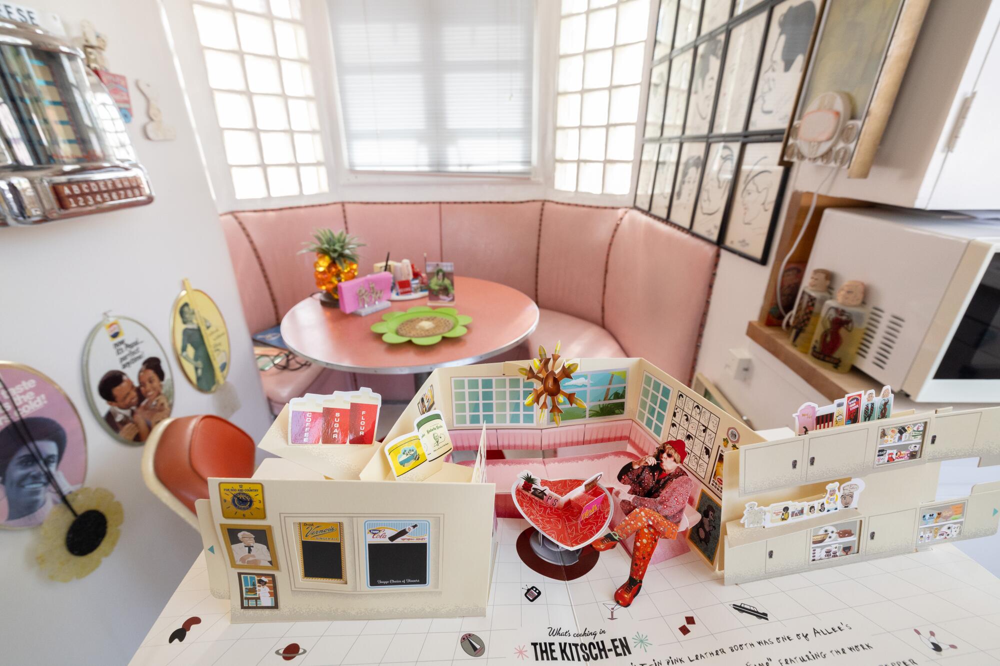The dining nook, one of Allee Willis's favorite places in her home, and the pop-up book version of the space.