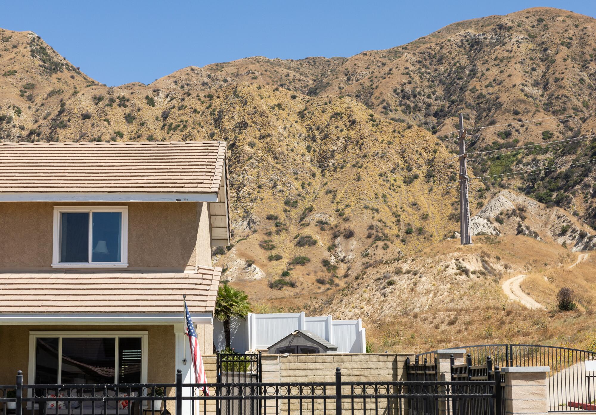Robert Delgado said the 2019 Saddle Ridge fire started at this powerline in the hillside behind his Sylmar house