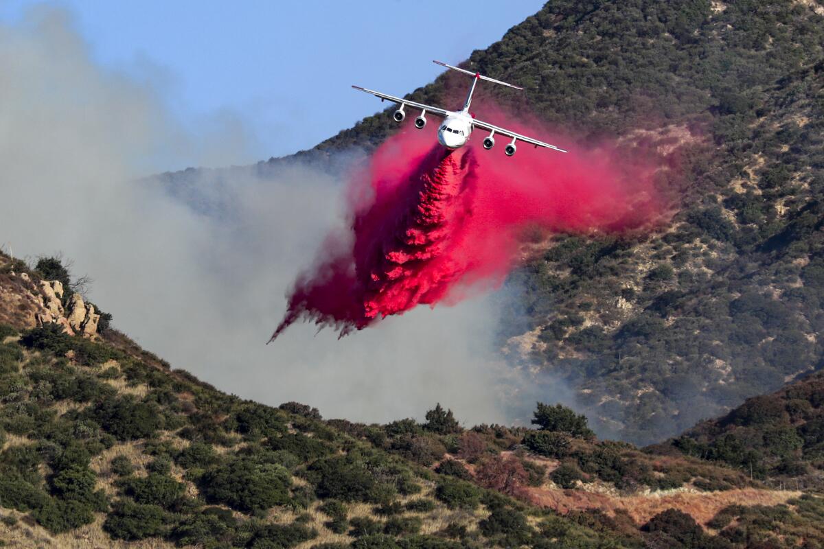 A firefighting plane dro red Phos-Chek