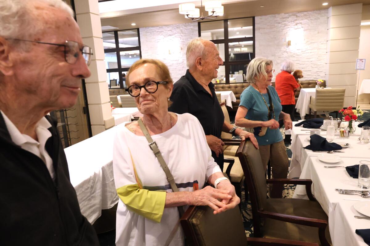 Fire evacuees Bill Klein, from left, his wife Renee, Joe Halper, and Janet H. at Avocet Playa Vista