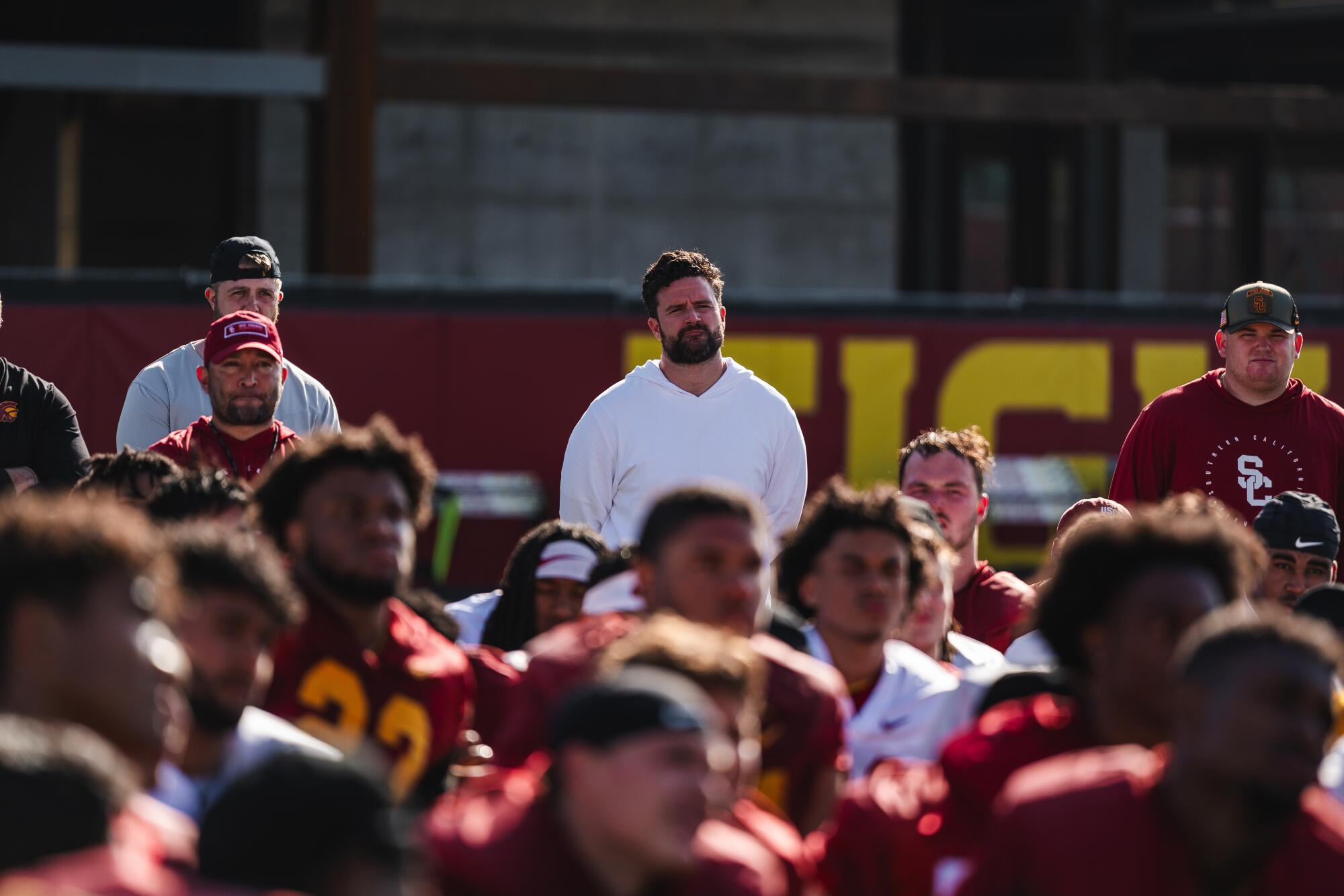 USC general manager Chad Bowden, center, attends a team practice.