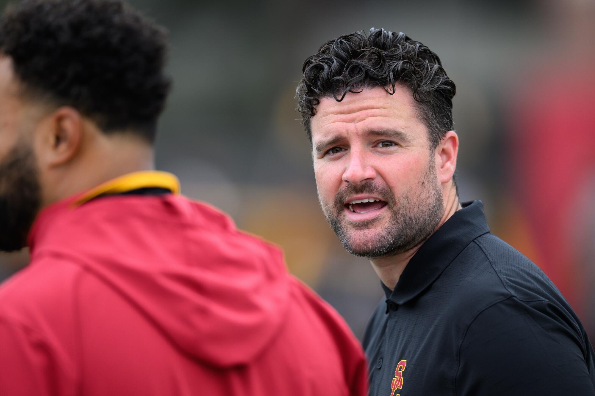 USC football general manager Chad Bowden looks across the field during preseason camp.