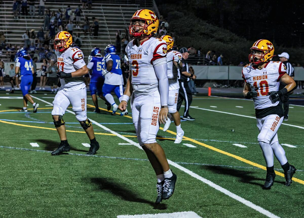 Luke Fahey celebrates with his Mission Viejo teammates after 7-3 win over Santa Margarita.