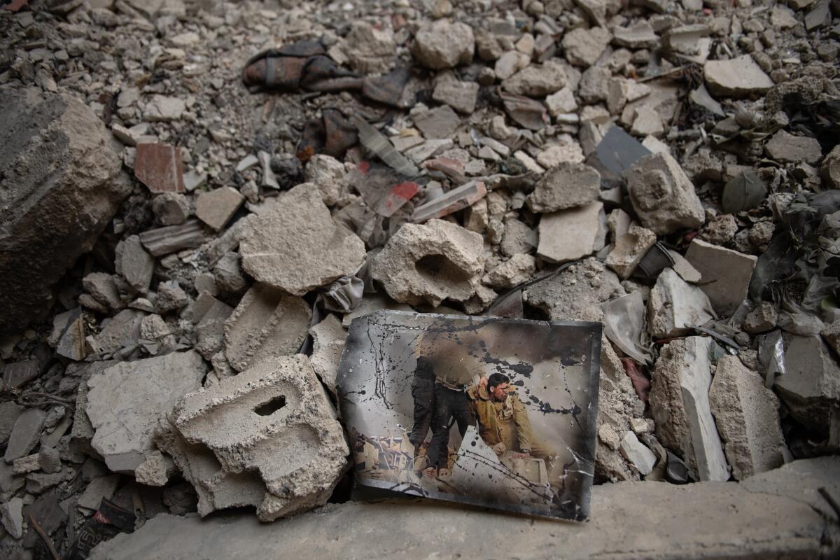 A pile of rubble reflects the damage to the Yarmouk headquarters of the Popular Front for the Liberation of Palestine - General Command.