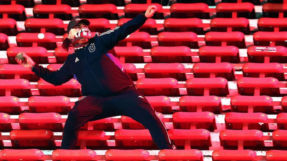 A supporter throws an object