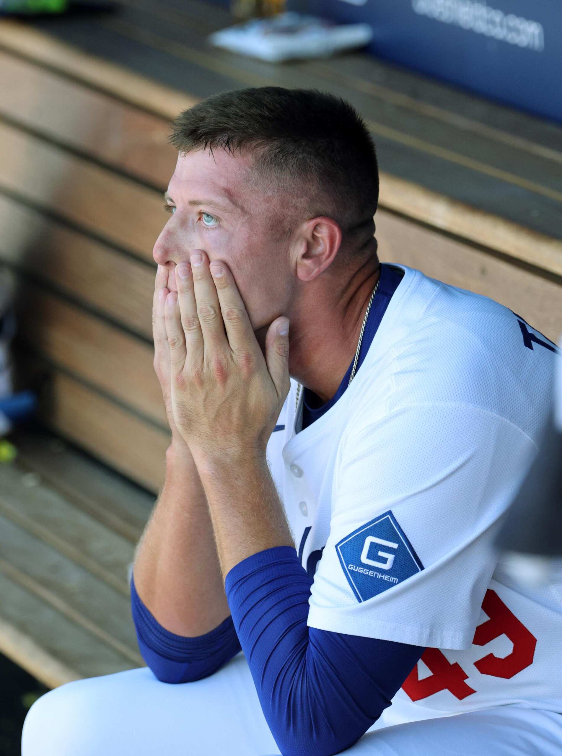 Dodgers reliever Blake Treinen watches from the dugout after giving up two home runs in the eighth inning Sunday.