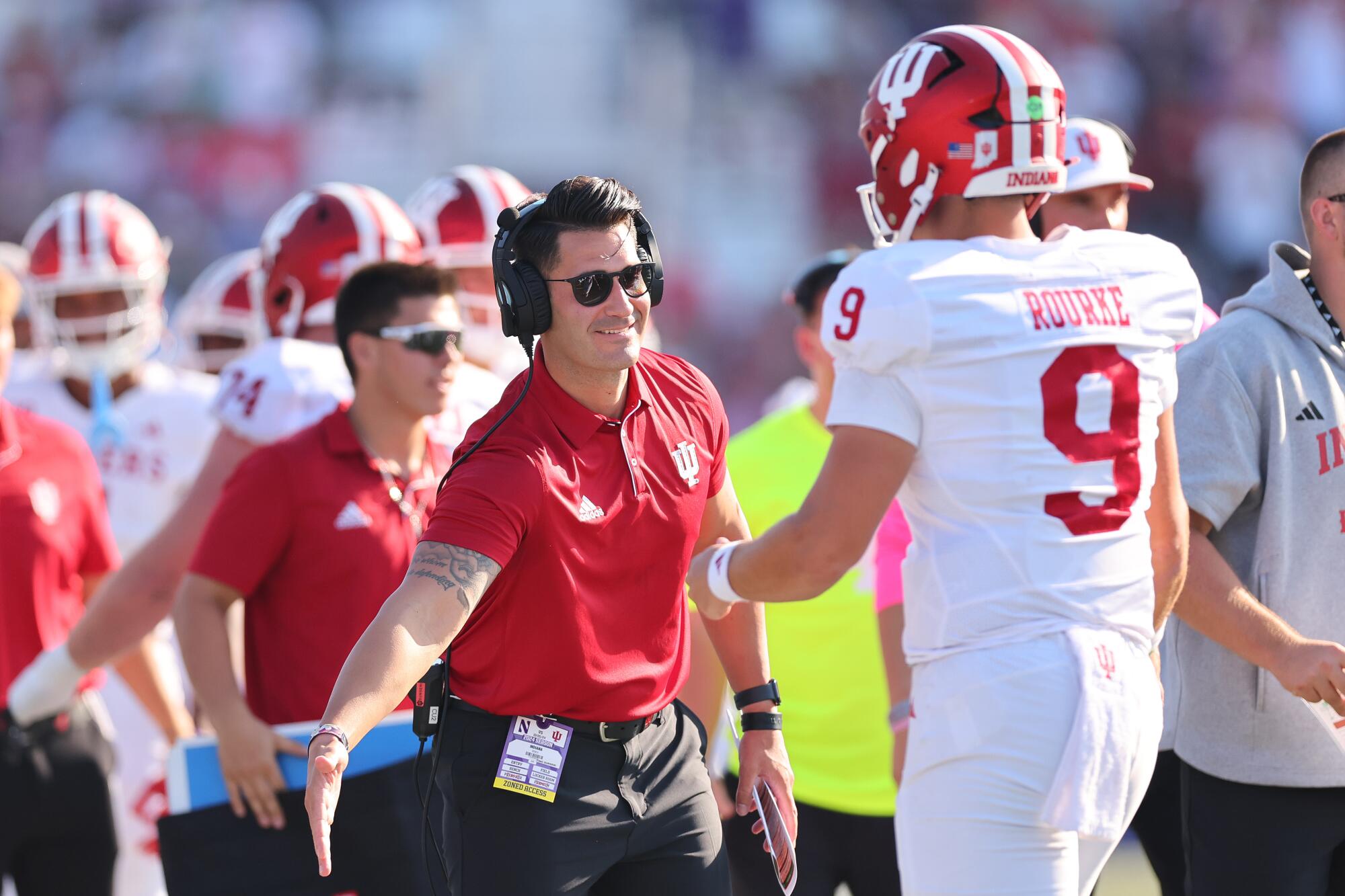 Tino Sunseri congratulates Indiana quarterback Kurtis Rourke during a game against Northwestern in October 2024.