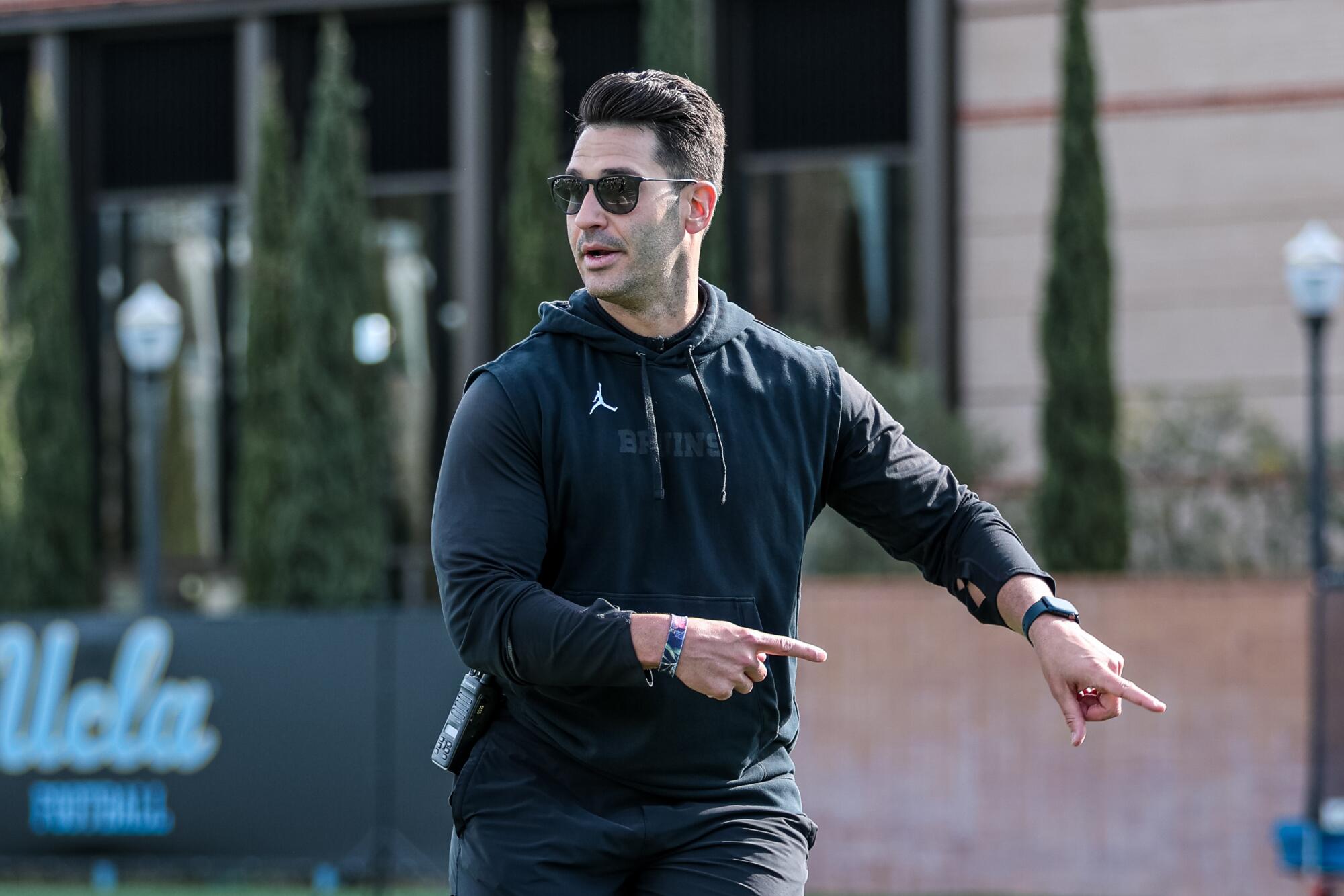 UCLA offensive coordinator and quarterbacks coach Tino Sunseri directs players during practice in April.