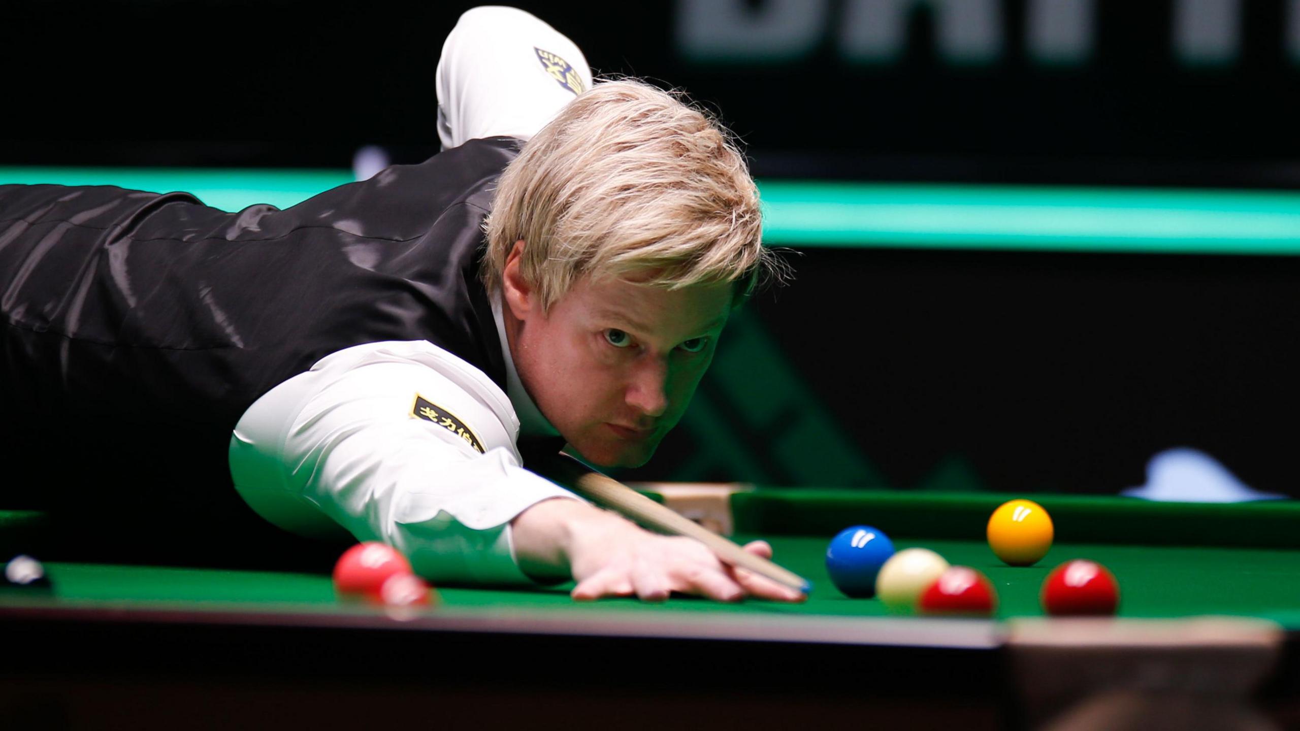 Neil Robertson plays a shot