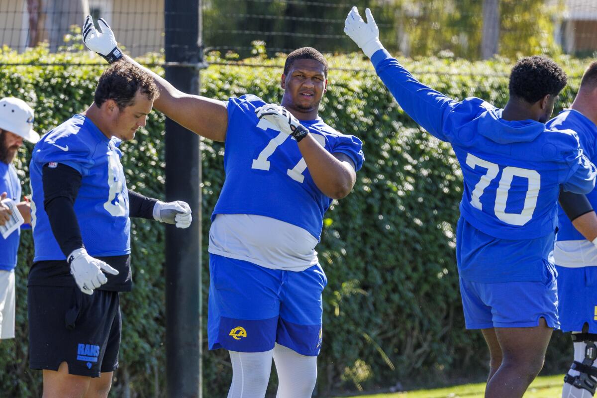 Rams offensive tackle Alaric Jackson stretches with teammates during training camp at Loyola Marymount on July 24.
