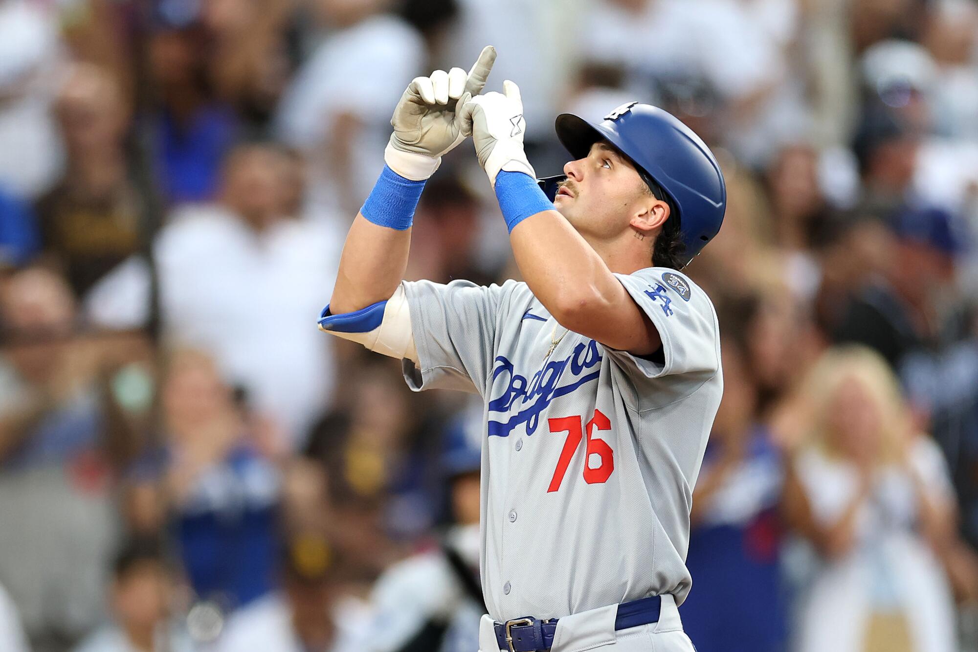 Alex Freeland celebrates after hitting a solo home run in the third inning of a 2-1 loss to the Padres on Friday.