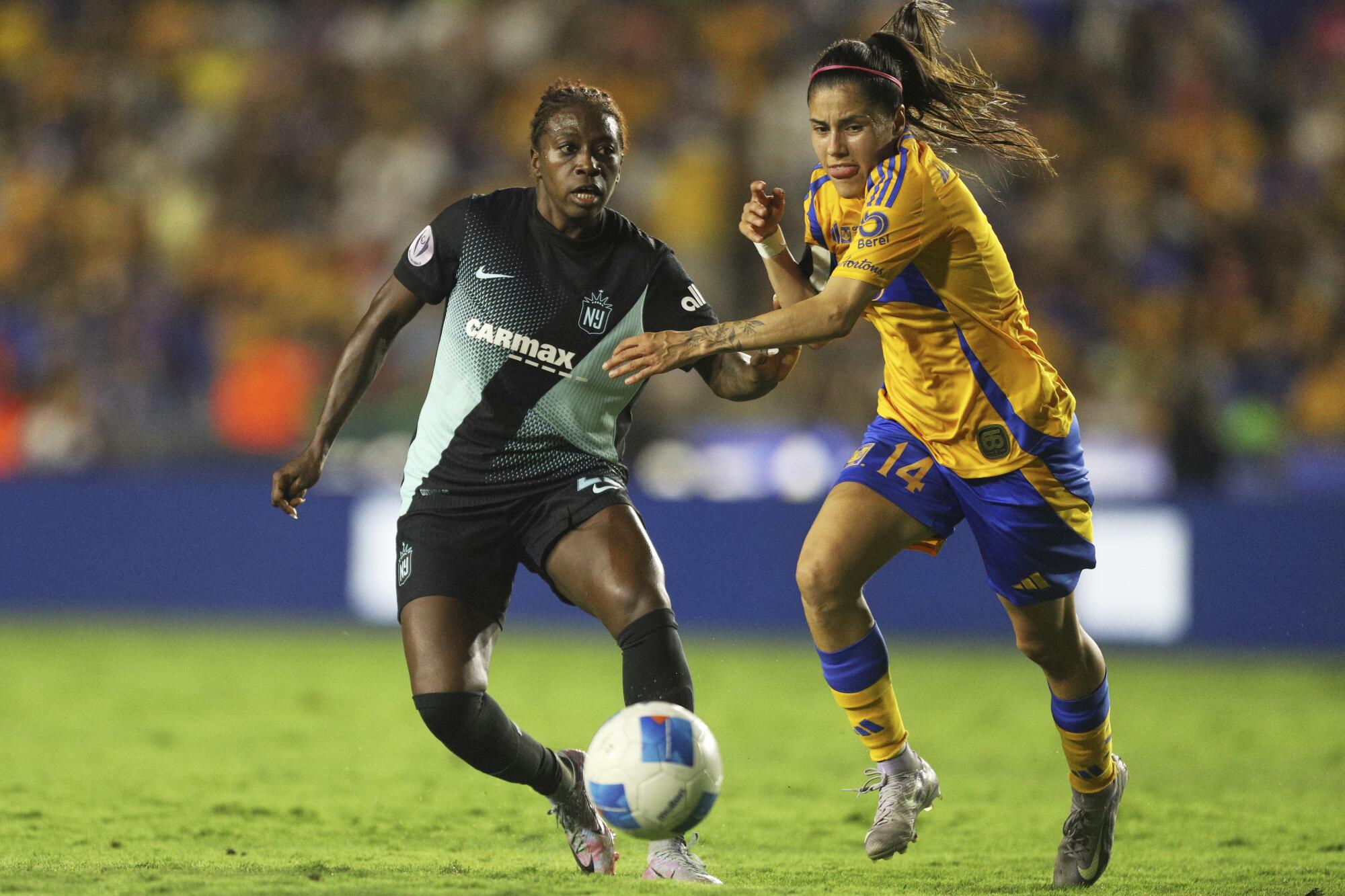 Lizbeth Ovalle of Tigres and Gotham FC's Miranda Freeman battle for the ball during the CONCACAF Champions Cup final.