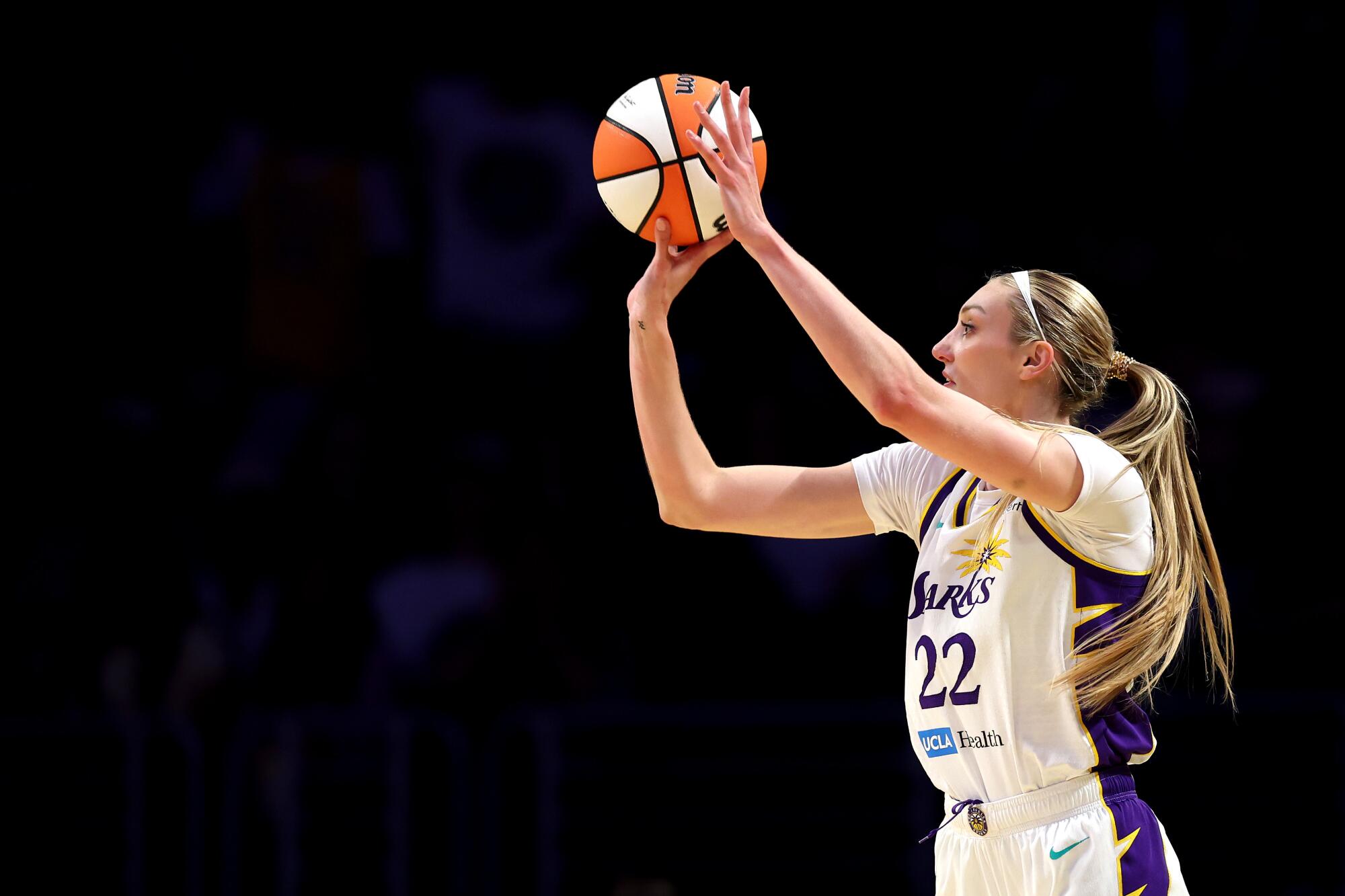 Sparks forward Cameron Brink shoots a three-pointer during a game against the Connecticut Sun on Aug. 7.