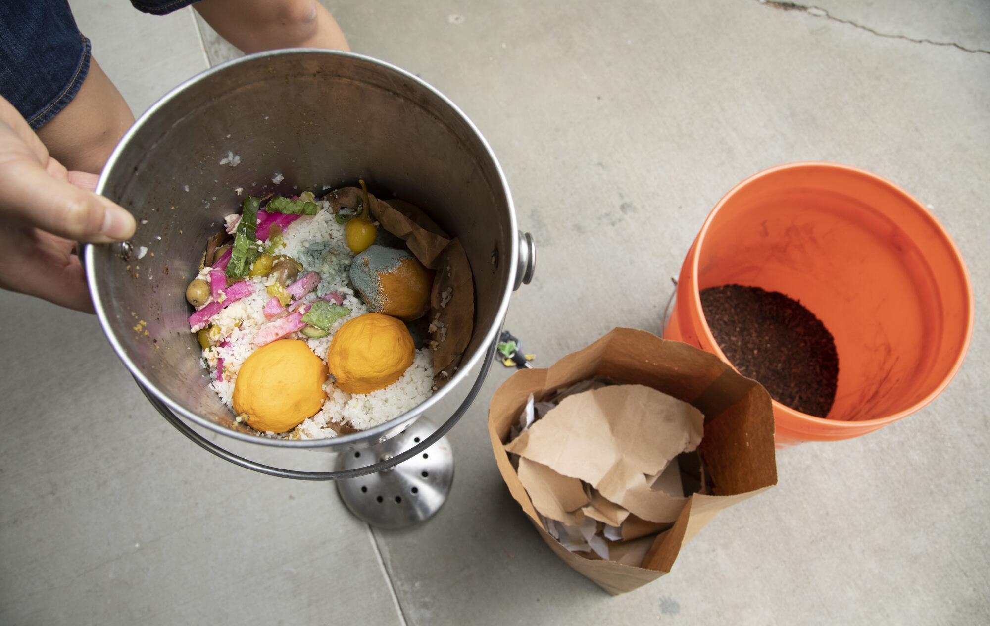 Food and paper waste is gathered in compost pails