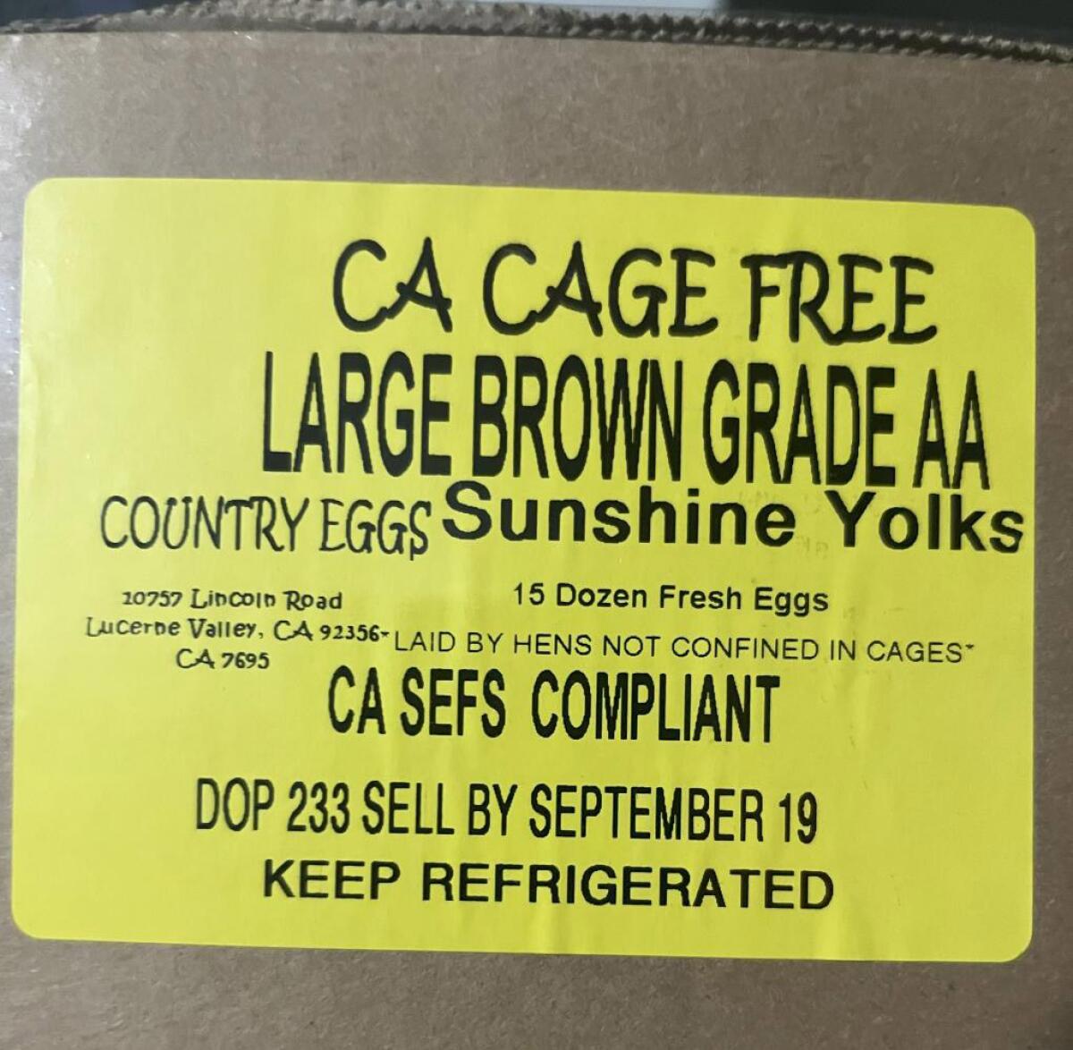 A label on the side of a brown box.