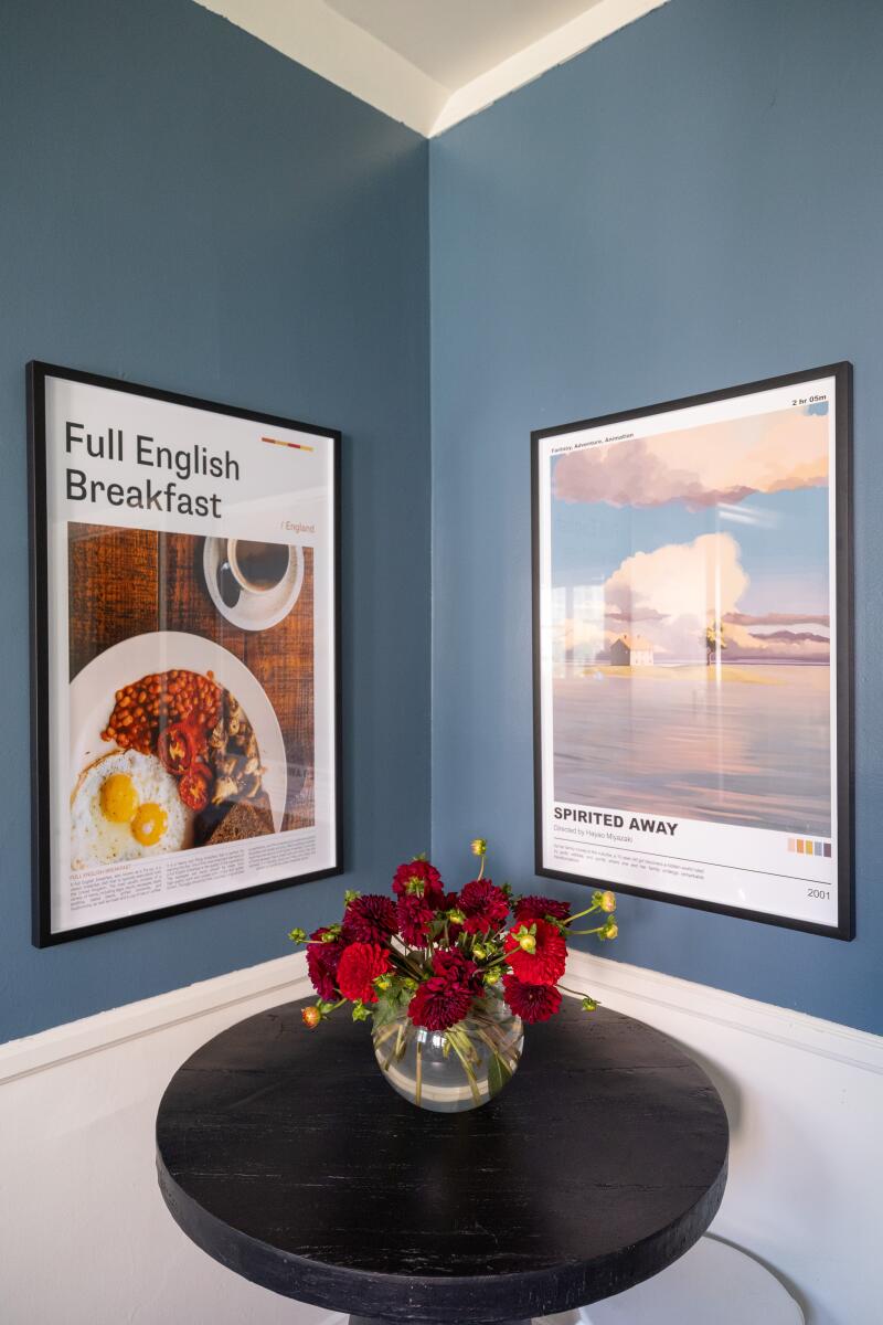 A small dining table in a corner of a kitchen.