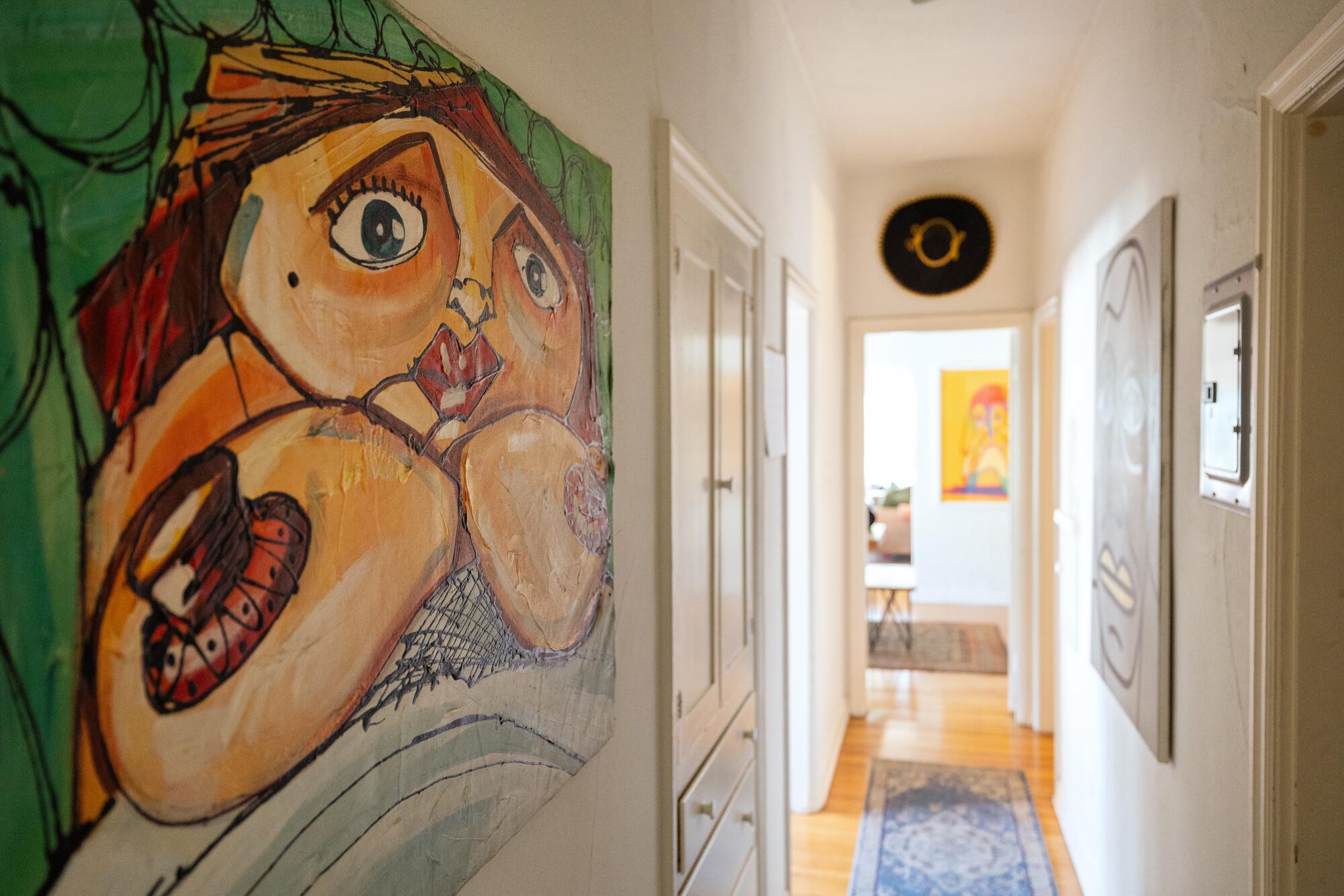 A hallway filled with paintings