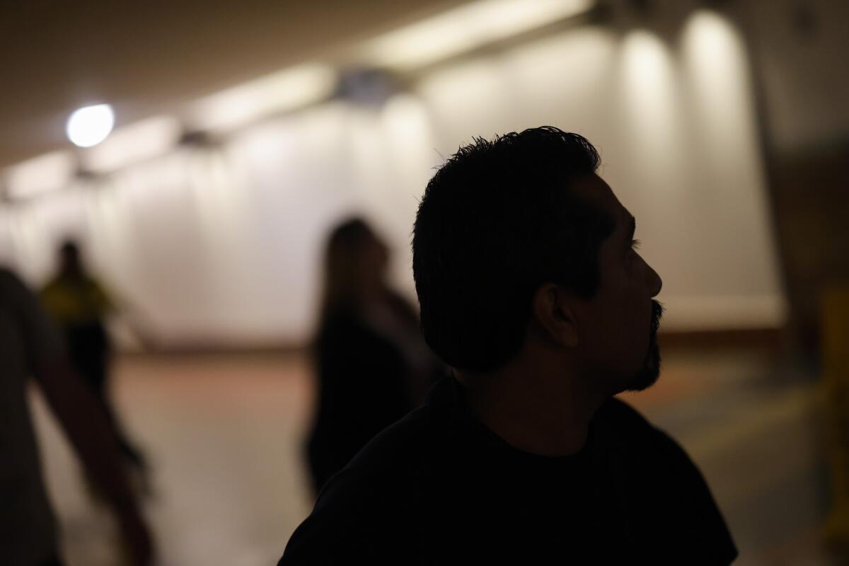 Angel Rodrigo Minguela Palacios' son walks through Union Station after being received by his family