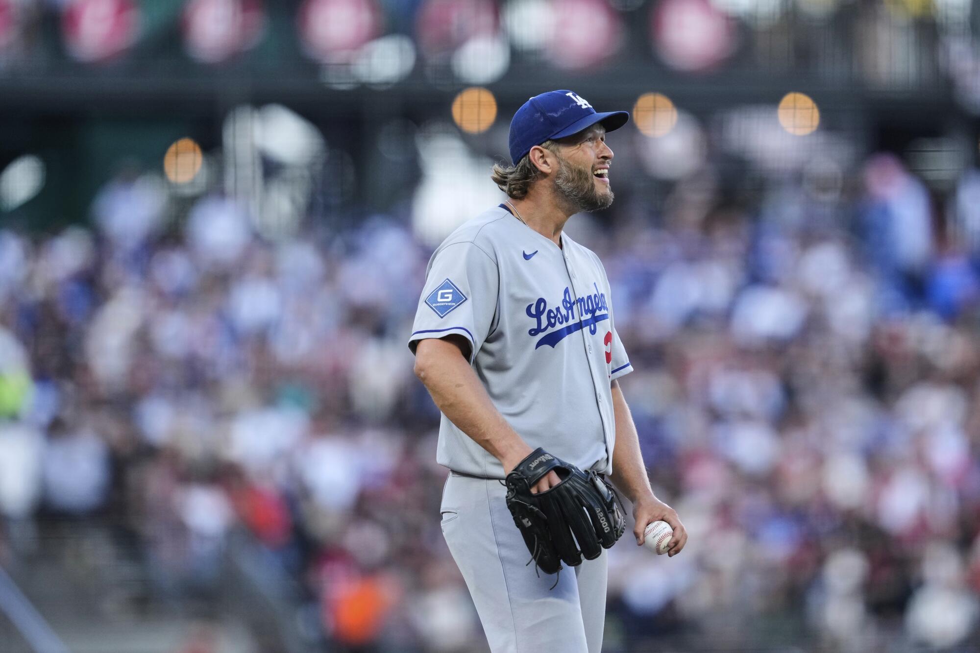 Dodgers starting pitcher Clayton Kershaw reacts after giving up an RBI single in the first inning Saturday.